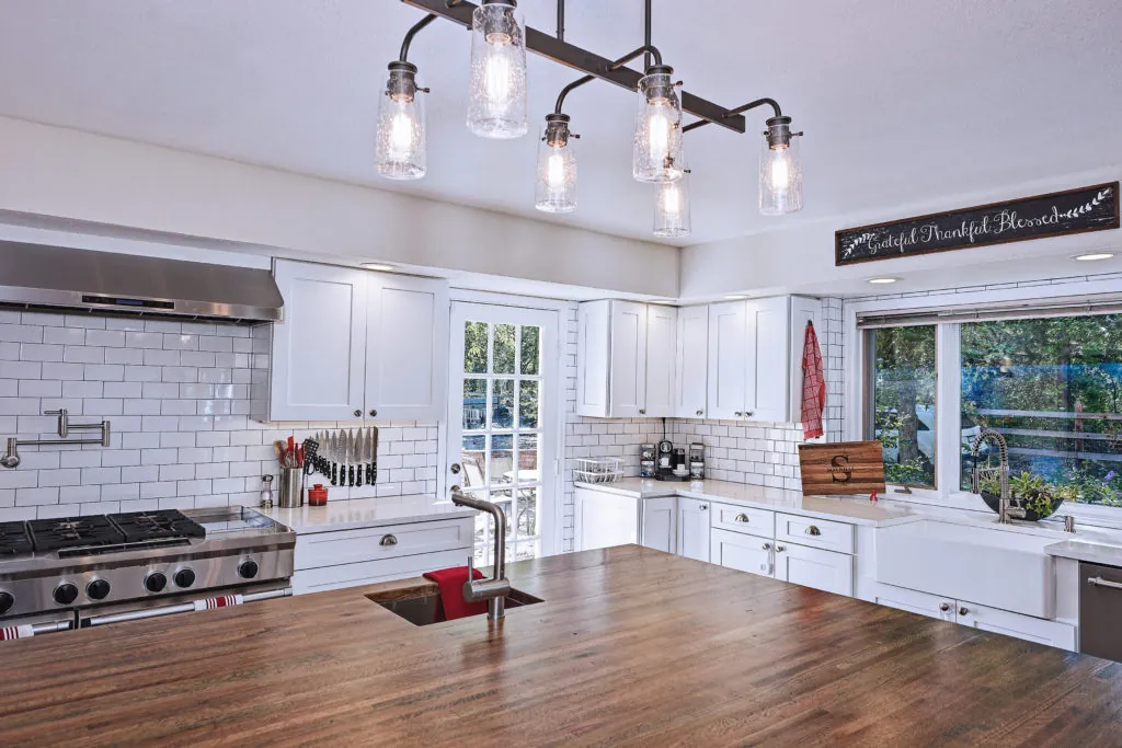 Dining area with wooden accents and modern lighting
